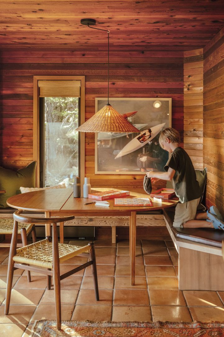 Child playing Scrabble on a wooden table
