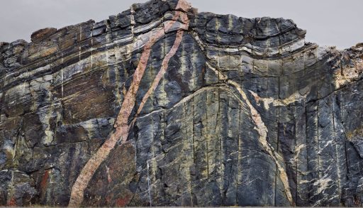 a rock cut of the Canadian shield along the highway