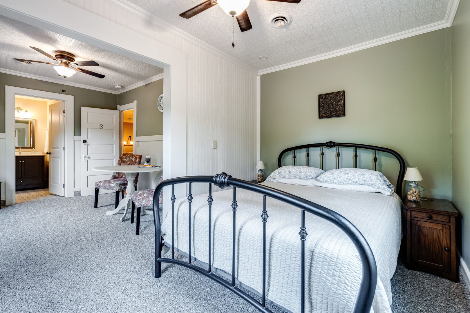 Bedroom with bed and white sheets