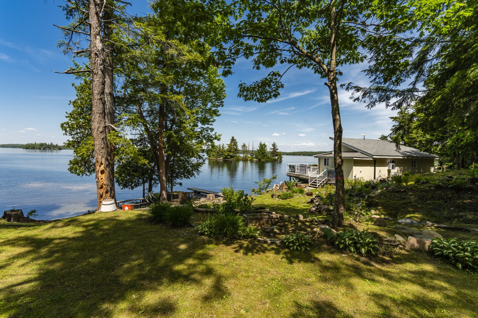 A grassy area next to a waterfront