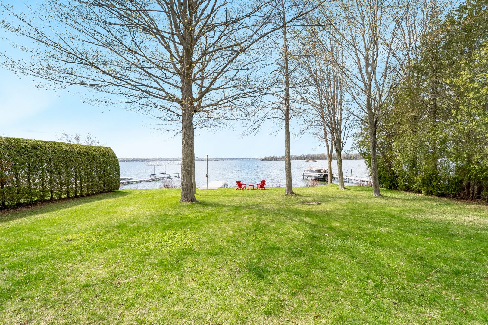A grassy lawn on a waterfront property