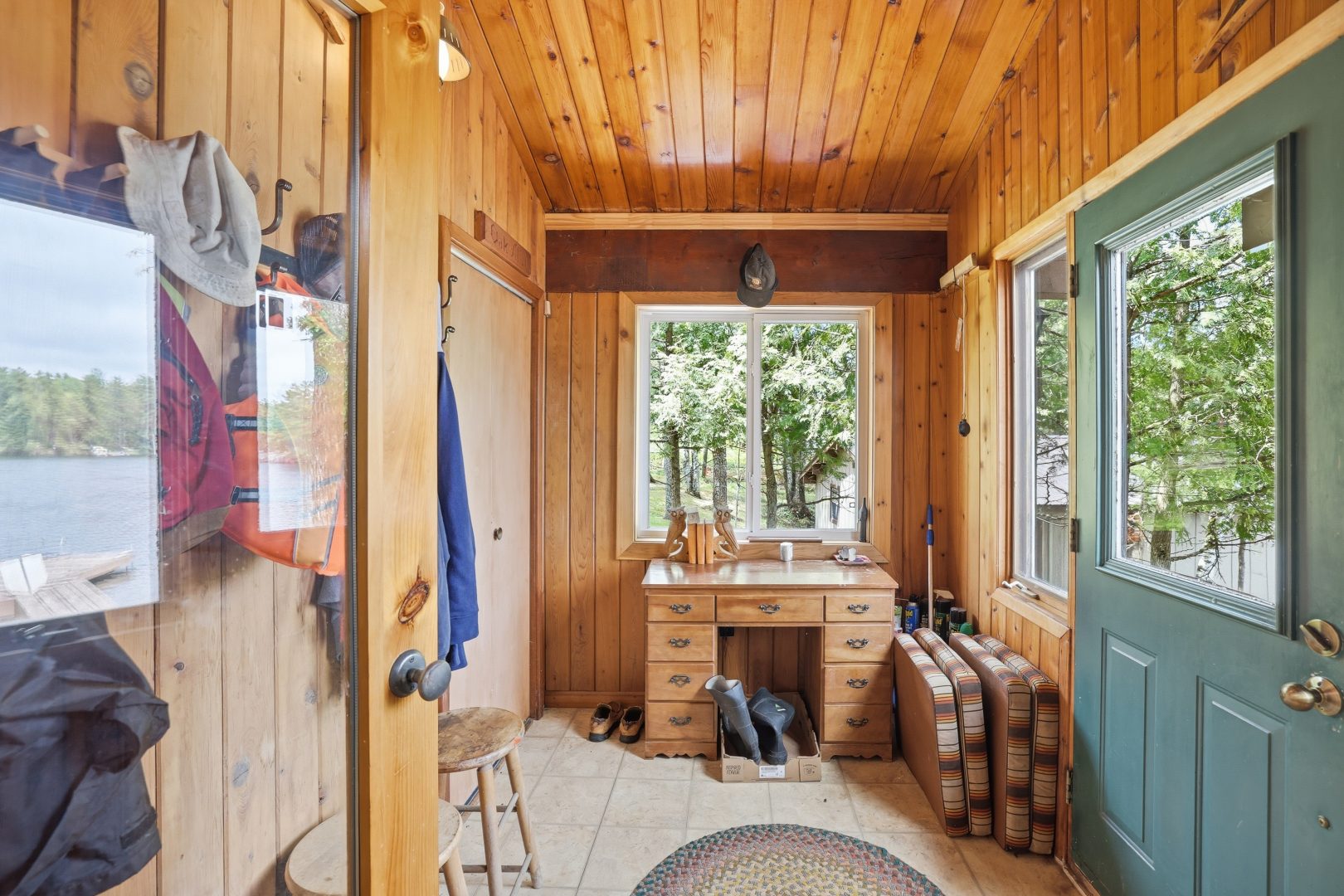 A wood-panelled entryway with a small wood desk