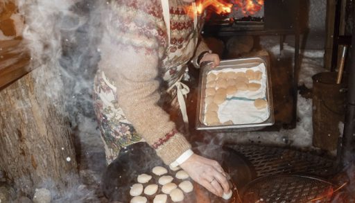 Christine Flynn cooking over a campfire