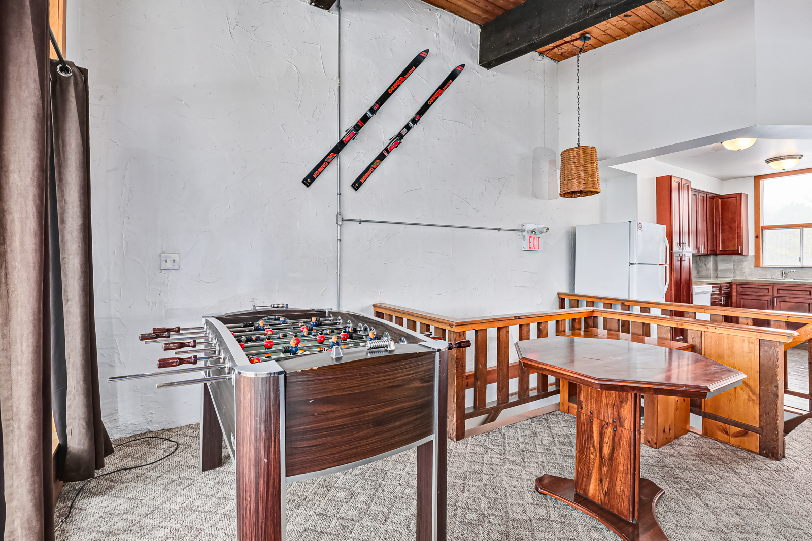 A fuseball table in a white room