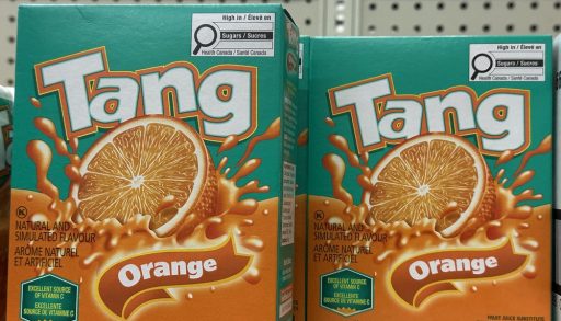 Two packages of Tang on a shelf