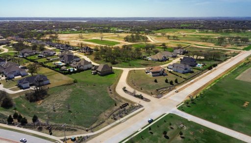 Undeveloped semi-rural neighbourhood beside a small town, green fields