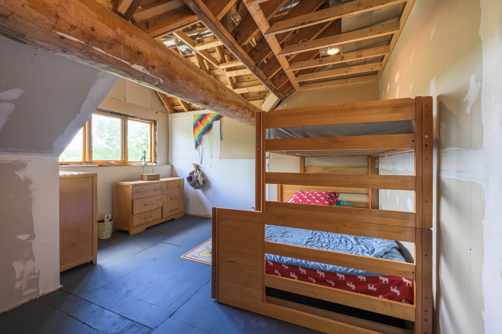 Wood bunk beds with quilted covers