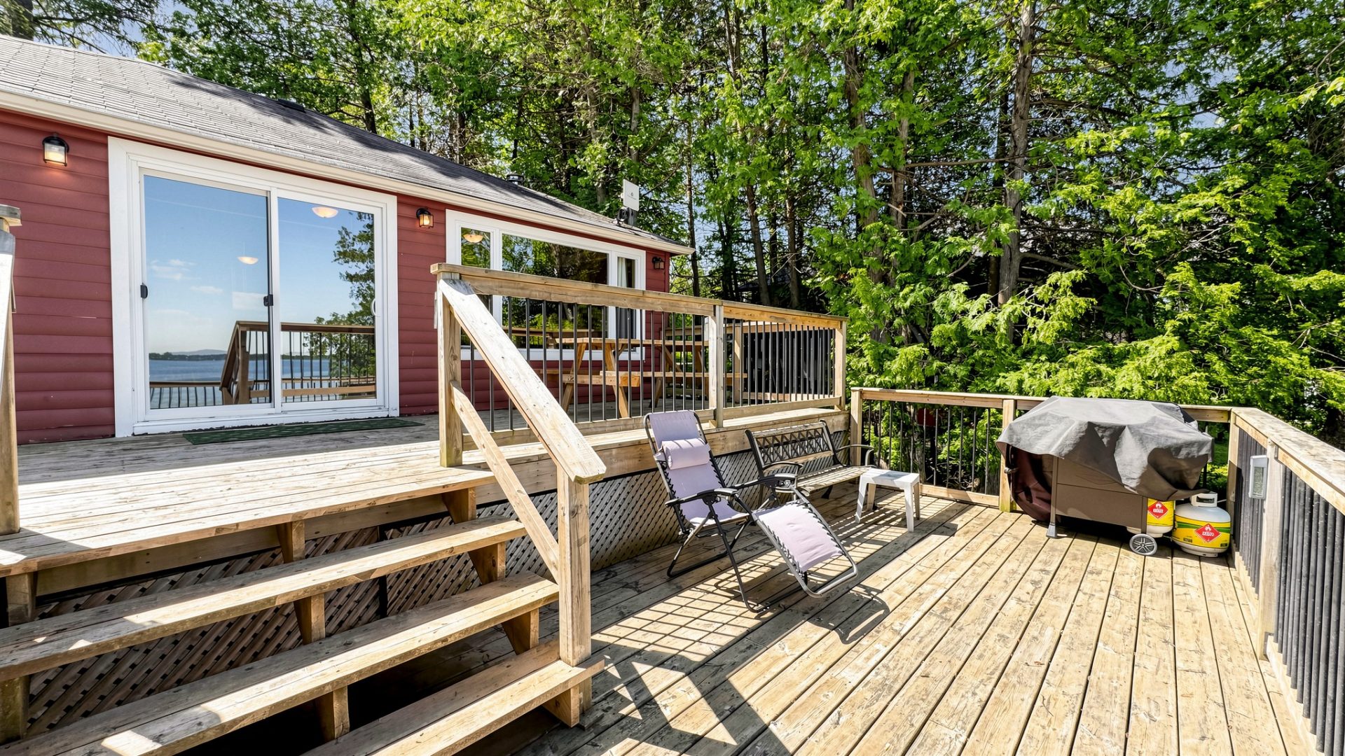A double deck on a red cottage