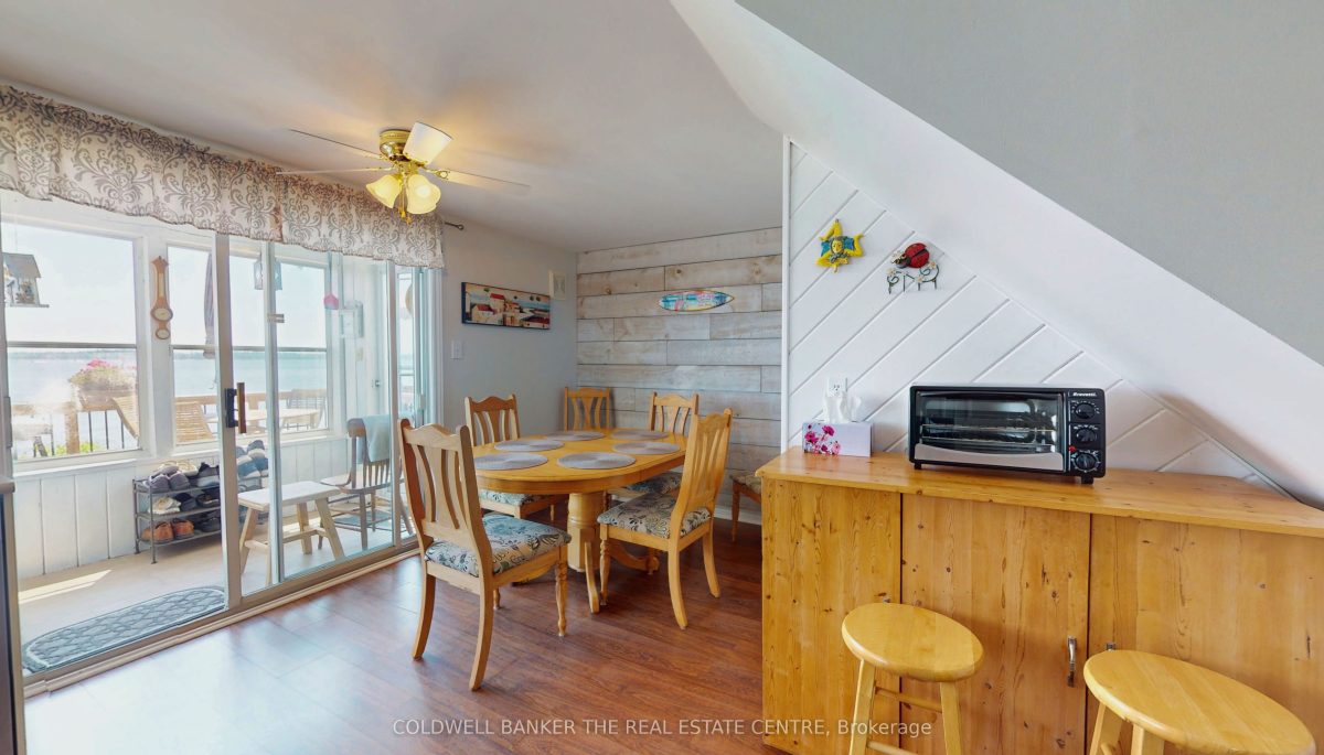 A small breakfast nook with a wood dining set