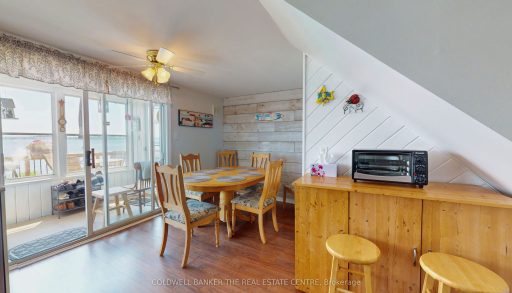 A small breakfast nook with a wood dining set