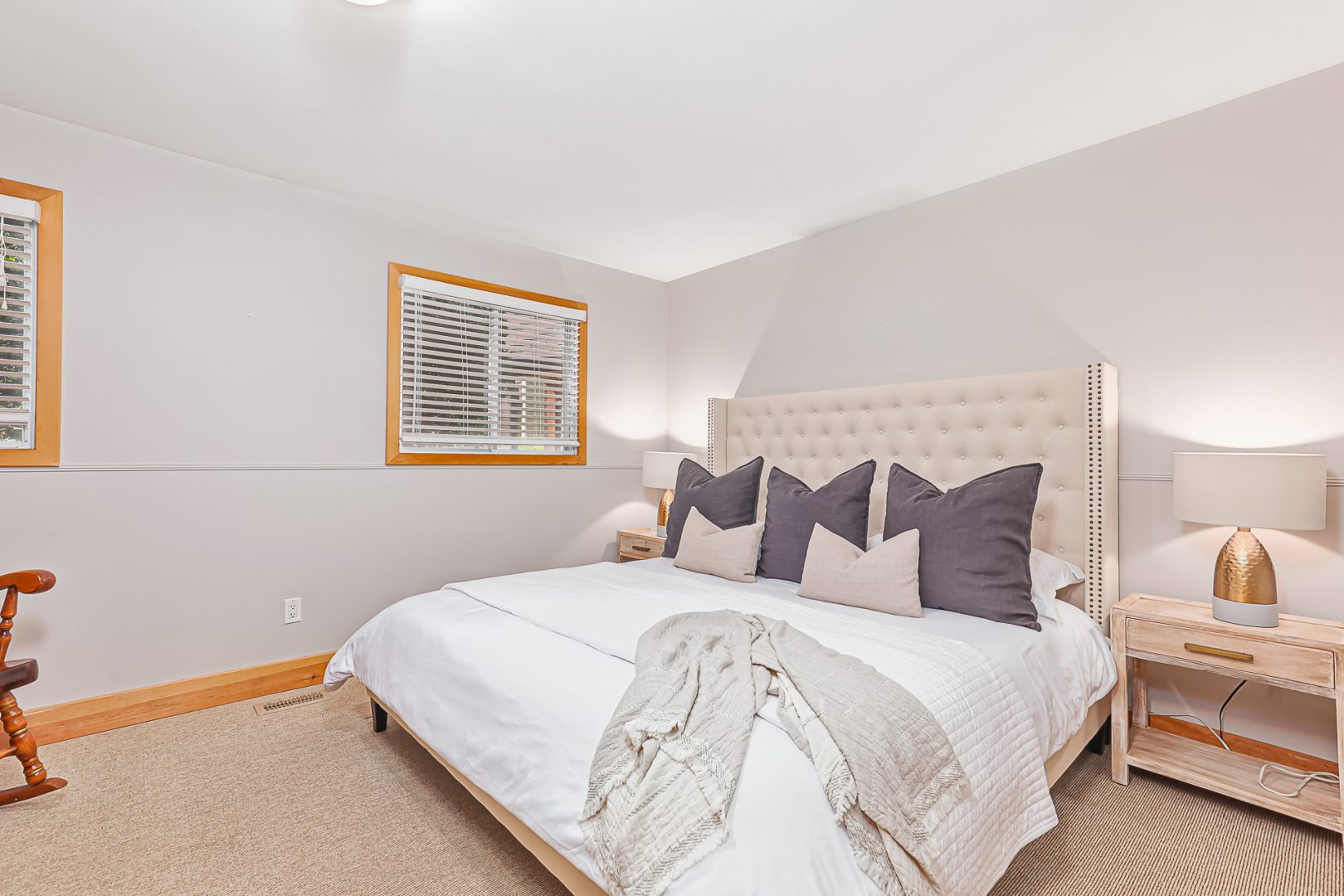 A white bed in a white bedroom