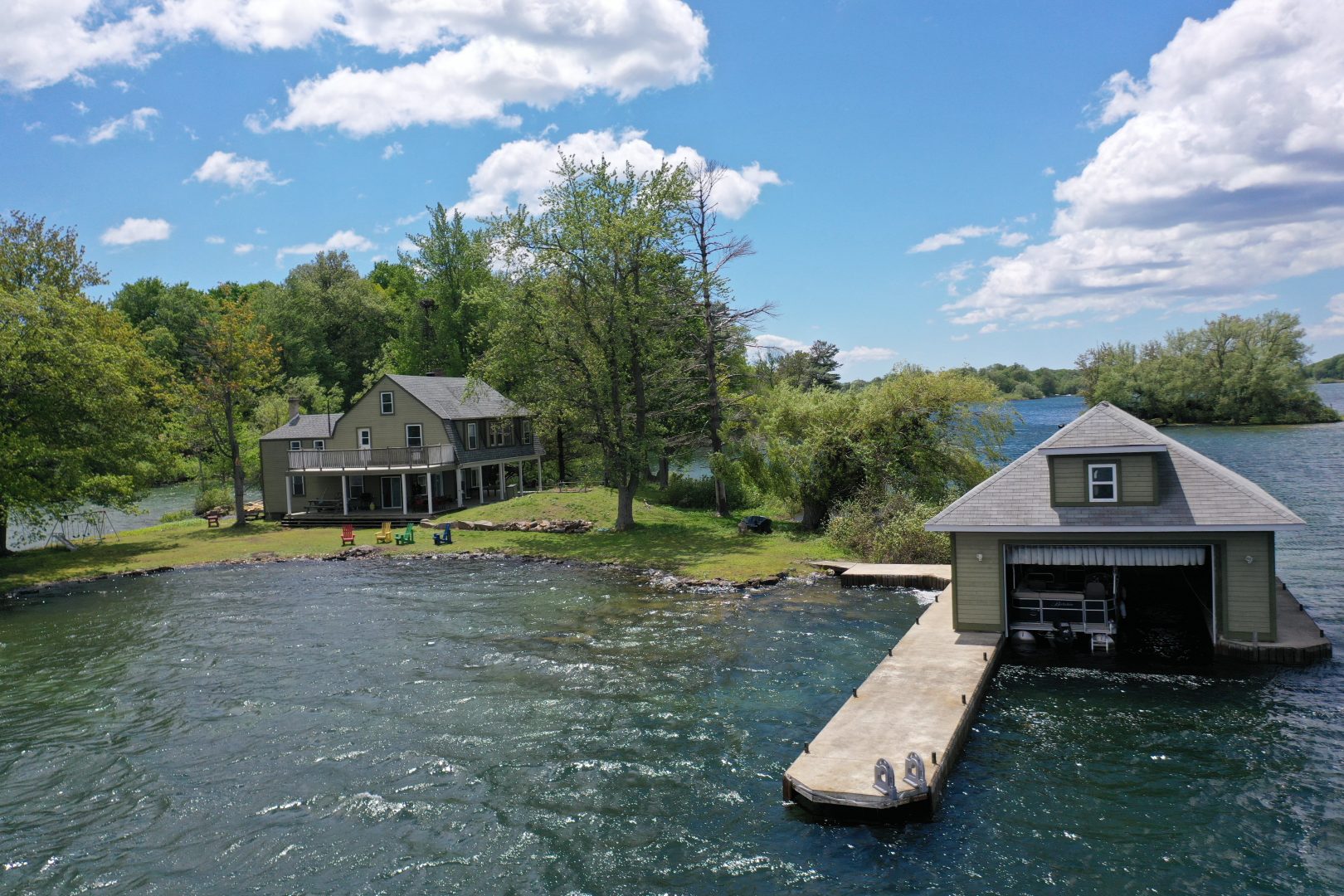 An island with a cottage and a dock