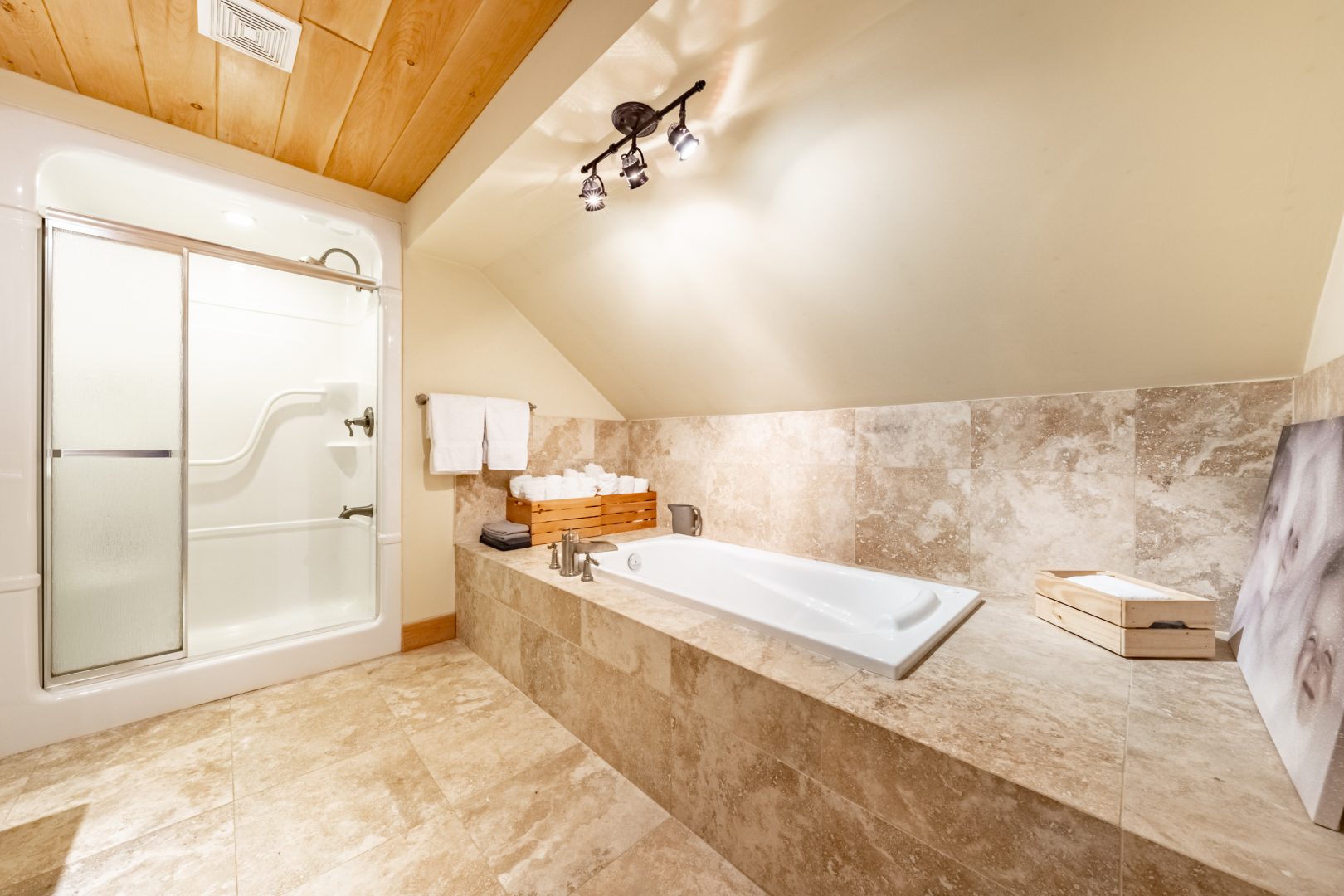 A stone bathtub in a beige bathroom
