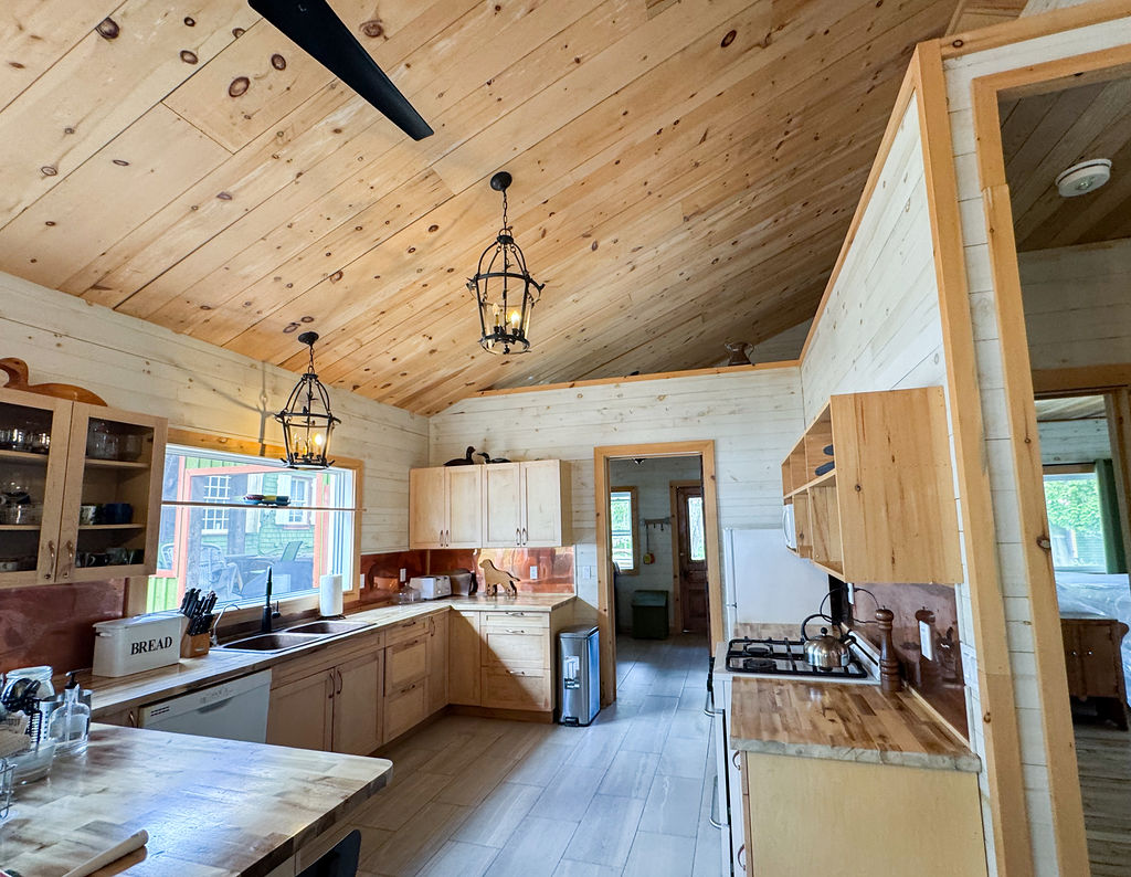 A light wood kitchen with tall ceilings