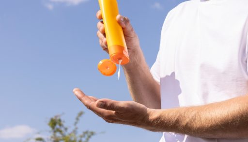 A man applying sunscreen