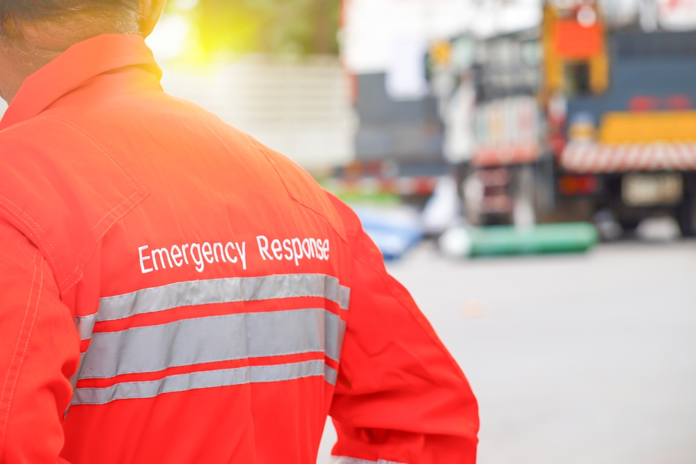 Emergency response person in an orange emergency response jumpsuit