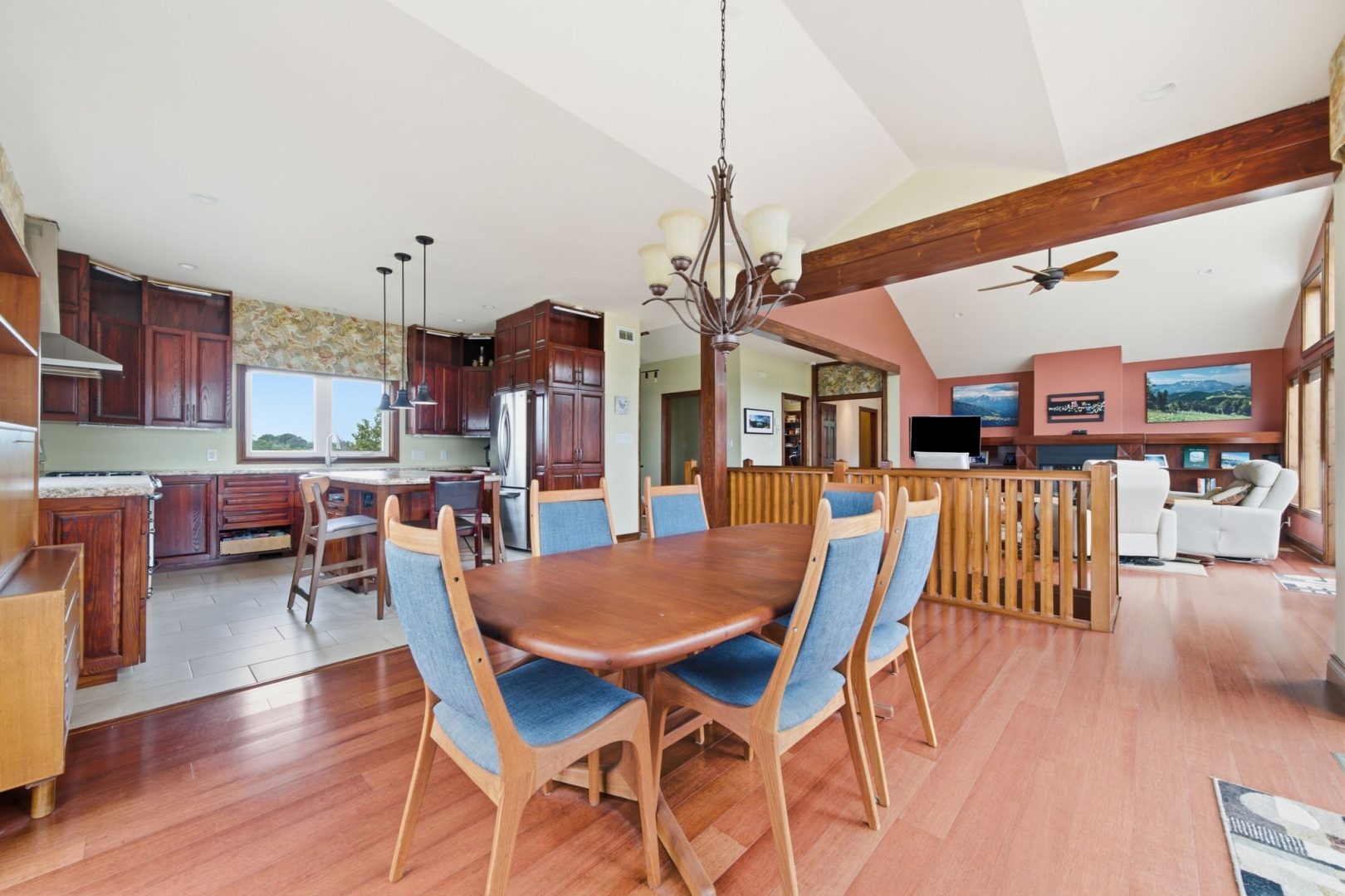 An open-concept living area with a dining room, l iving room and kitchen