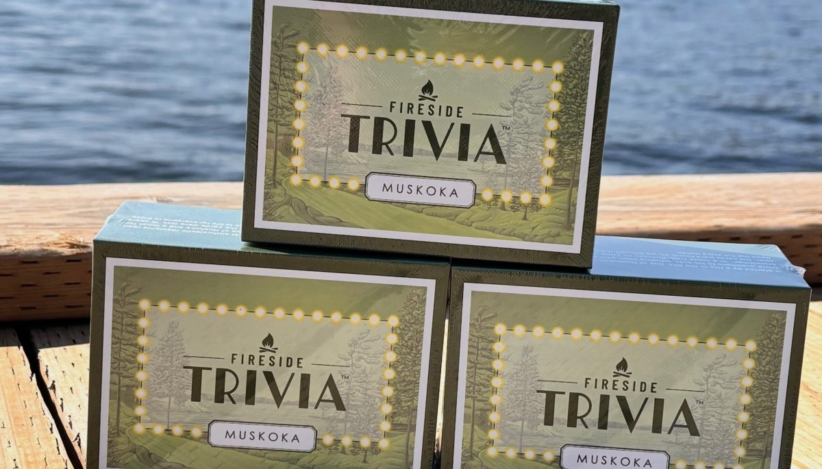 Three boxes of the trivia game stacked on the dock