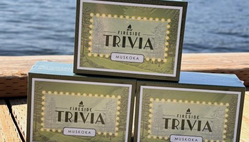Three boxes of the trivia game stacked on the dock